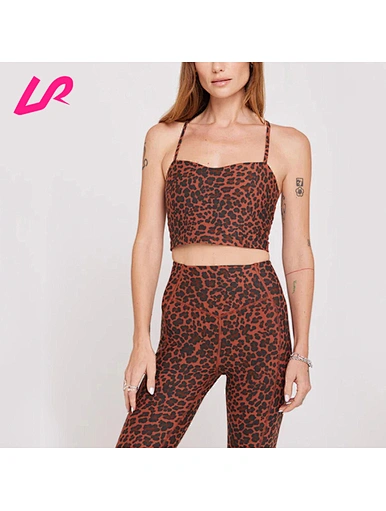Cover up in style with our Leopard Print Sports Bra. Designed for comfort and support, it's a must-have for any workout wardrobe. Shop now and stay ahead of the trend.